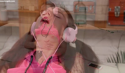 Cute brunette teen in a pink t-shirt and jean shorts puts on a good show