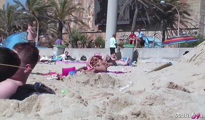 Lesbian teen couple has sex on the beach while the public is watching carefully