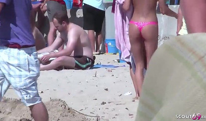 Lesbian teen couple has sex on the beach while the public is watching carefully
