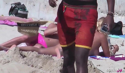 Lesbian teen couple has sex on the beach while the public is watching carefully