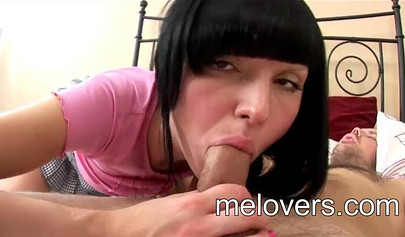 Teen with dark hair and bangs slurps on a huge dick which then goes in her pussy