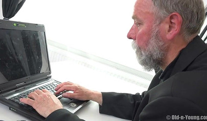 An old pervert fucks a nice petite brunette teen in his small cubicle office