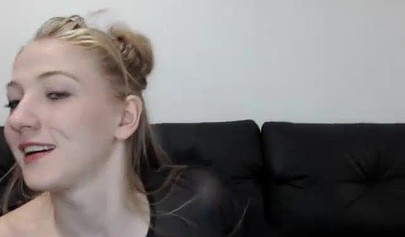 Slim blonde teen strips naked to rub herself and suck a hard cock on a webcam