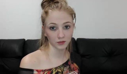 Slim blonde teen strips naked to rub herself and suck a hard cock on a webcam