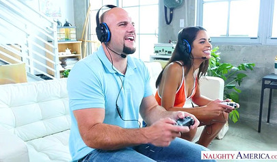 Tiny Latina teenie chokes on a huge cock and rides it after playing a video game