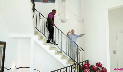 Dirty black-haired teen chokes on a big black cock before having her ass railed