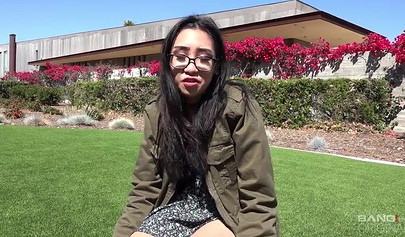 Skinny Asian teen with glasses has her throat and pussy penetrated by a big cock