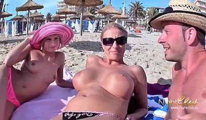 Two German teens have some fun at the beach with a guy and a black strap-on