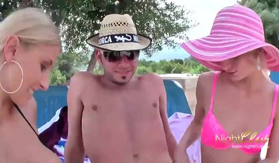 Two German teens have some fun at the beach with a guy and a black strap-on