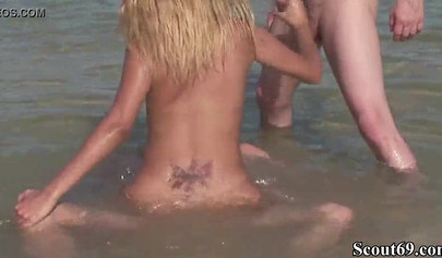 Extremely sexy teen gets fucked in the asshole by two guys on a public beach