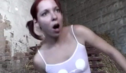 Redhead German girls fucks and sucks two large dicks inside a village barn