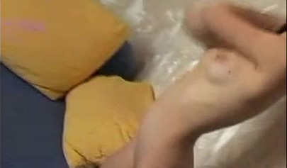 Beautiful schoolgirl teenage brunette in a solo video with a big pink dildo