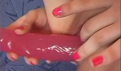 Beautiful schoolgirl teenage brunette in a solo video with a big pink dildo