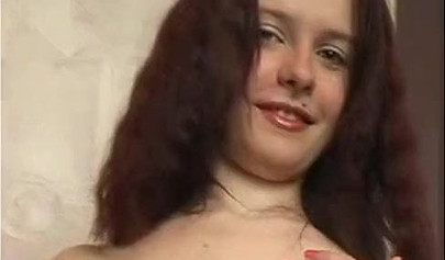 Beautiful schoolgirl teenage brunette in a solo video with a big pink dildo