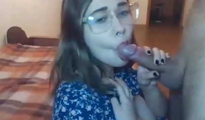 Busty teen with glasses gives a cool blowjob to her boyfriend on a web cam show