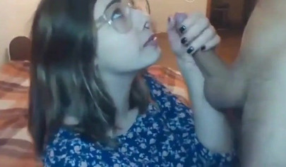 Busty teen with glasses gives a cool blowjob to her boyfriend on a web cam show