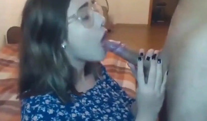 Busty teen with glasses gives a cool blowjob to her boyfriend on a web cam show