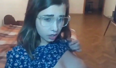 Busty teen with glasses gives a cool blowjob to her boyfriend on a web cam show