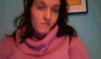 Amateur dark-haired nubile strips naked on a web cam and shows her massive boobs