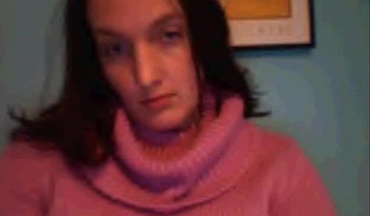 Amateur dark-haired nubile strips naked on a web cam and shows her massive boobs