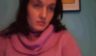 Amateur dark-haired nubile strips naked on a web cam and shows her massive boobs