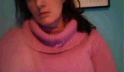 Amateur dark-haired nubile strips naked on a web cam and shows her massive boobs