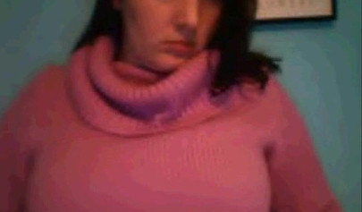 Amateur dark-haired nubile strips naked on a web cam and shows her massive boobs