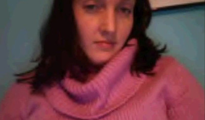 Amateur dark-haired nubile strips naked on a web cam and shows her massive boobs