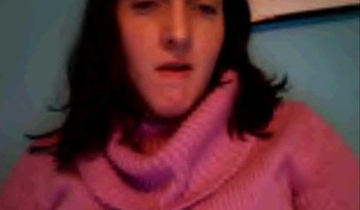 Amateur dark-haired nubile strips naked on a web cam and shows her massive boobs