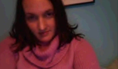 Amateur dark-haired nubile strips naked on a web cam and shows her massive boobs