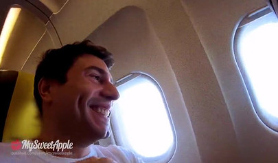 Brunette teenage girl makes a risky move by sucking a huge dick on an airplane