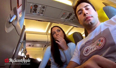 Brunette teenage girl makes a risky move by sucking a huge dick on an airplane