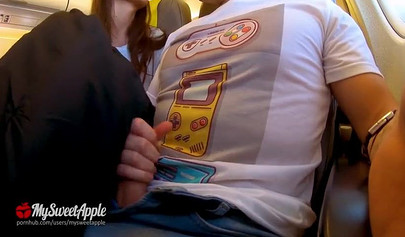 Brunette teenage girl makes a risky move by sucking a huge dick on an airplane