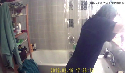 Busty and chubby teenage girl poses in the bathroom and takes a long shower