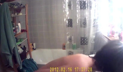 Busty and chubby teenage girl poses in the bathroom and takes a long shower