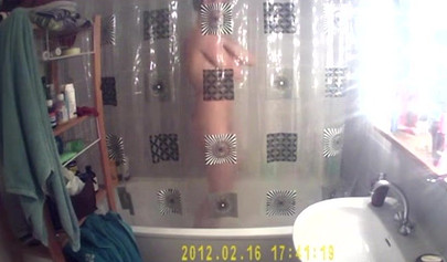 Busty and chubby teenage girl poses in the bathroom and takes a long shower