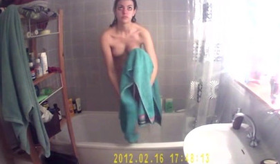 Busty and chubby teenage girl poses in the bathroom and takes a long shower