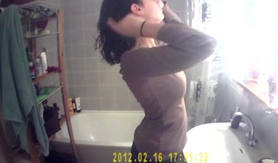 Busty and chubby teenage girl poses in the bathroom and takes a long shower