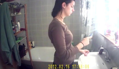 Busty and chubby teenage girl poses in the bathroom and takes a long shower