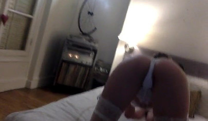 Blonde teenage girl in lingerie puts on a solo show and records in on camera