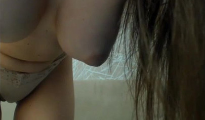 Busty teen brunette enjoys playing with herself on a camera for your pleasure