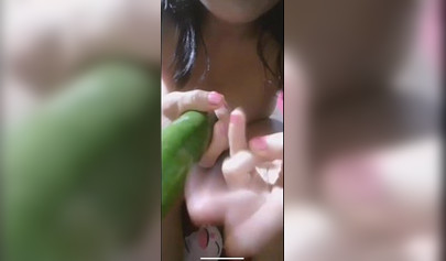 Amateur slut fucks her ass with cucumber
