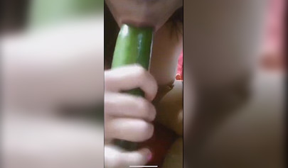 Amateur slut fucks her ass with cucumber