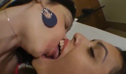 Mom and daughter kissing before licking