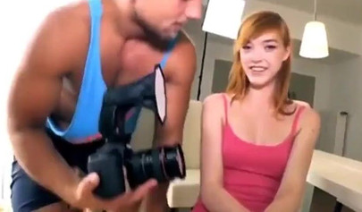 Redhead teen takes photographer's big cock in her slimy pussy