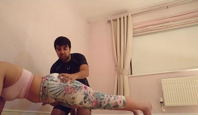 Asian whore with big ass kneels and gets her pussy pleasured by a horny dude