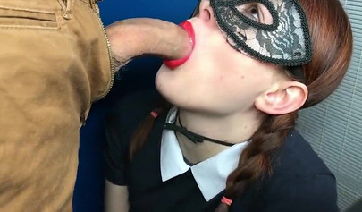 Masked redhead gives lovely fellatio to a dude with big cock
