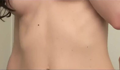 Lovely petite lesbians enjoy each other's bodies on the bed