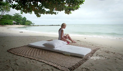 Petite Lilit A enjoys erotic massage on the beach