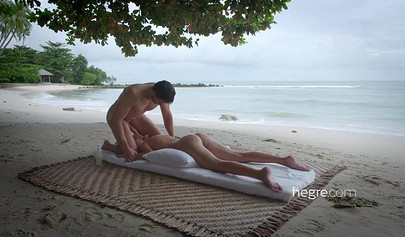 Petite Lilit A enjoys erotic massage on the beach